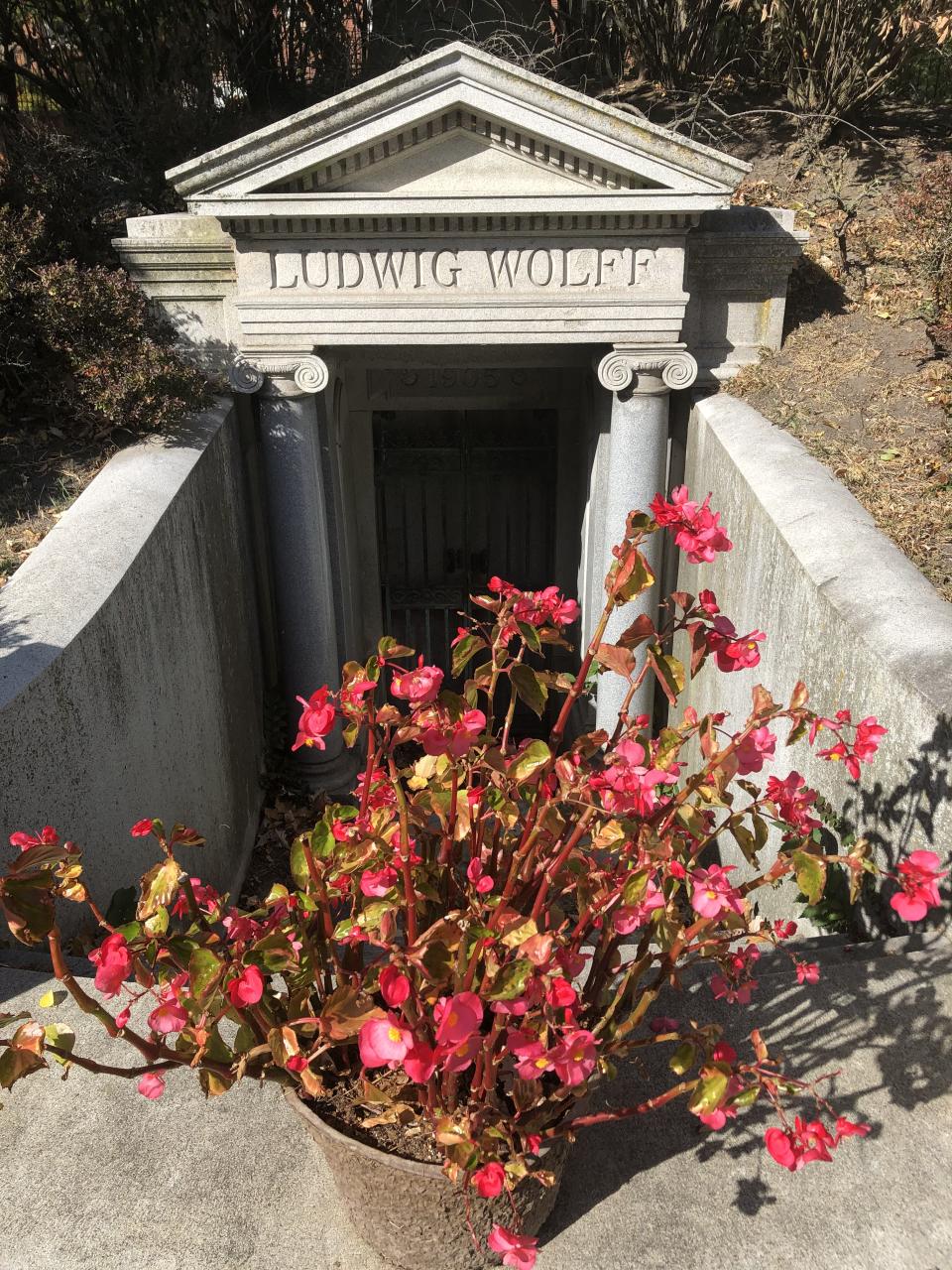 Flowers sit at the top of the steps that lead to the mausoleum that houses the remains of Ludwig Wolff. (Eric DeGrechie/Patch)