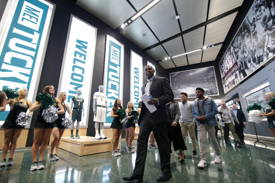 Mel Tucker, Michigan State's new football coach, enters a news conference Wednesday, Feb. 12, 2020, in East Lansing, Mich. (AP Photo/Al Goldis)