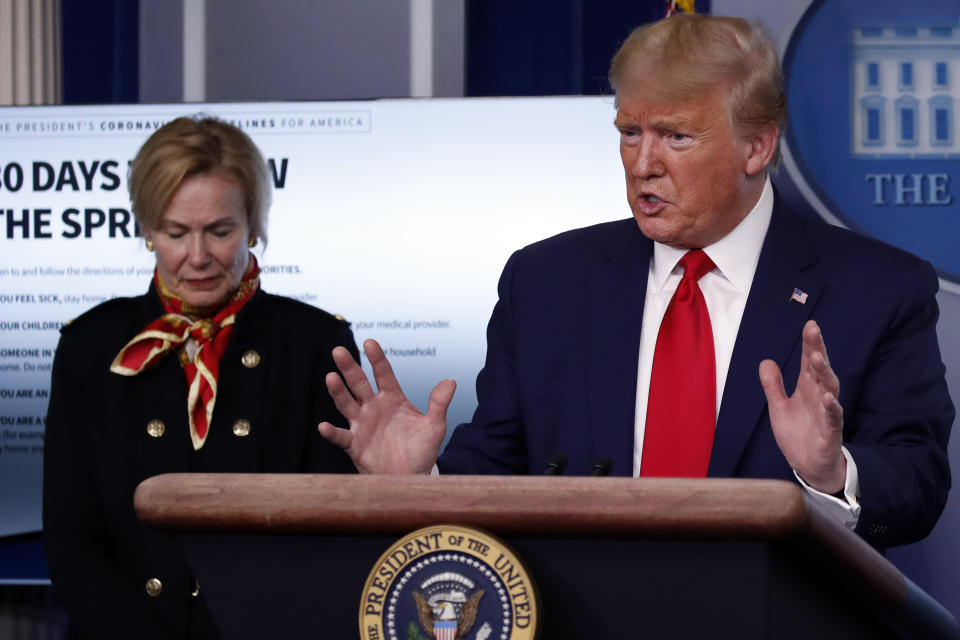 President Donald Trump speaks about the coronavirus in the James Brady Press Briefing Room of the White House, Tuesday, March 31, 2020, in Washington, as Dr. Deborah Birx, White House coronavirus response coordinator, listens. (AP Photo/Alex Brandon)