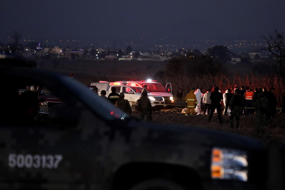 Emergency rescue personnel, the army and the police arrive to the scene of a helicopter crash where Puebla Gov. Martha Erika Alonso and her husband Rafael Moreno Valle, a former Puebla governor, died near Puebla City, southeast of Mexico City on Monday, Dec. 24, 2018. The husband-and-wife political power couple died Christmas Eve in the crash, Mexican officials reported. (AP Photo/Pablo Spencer)