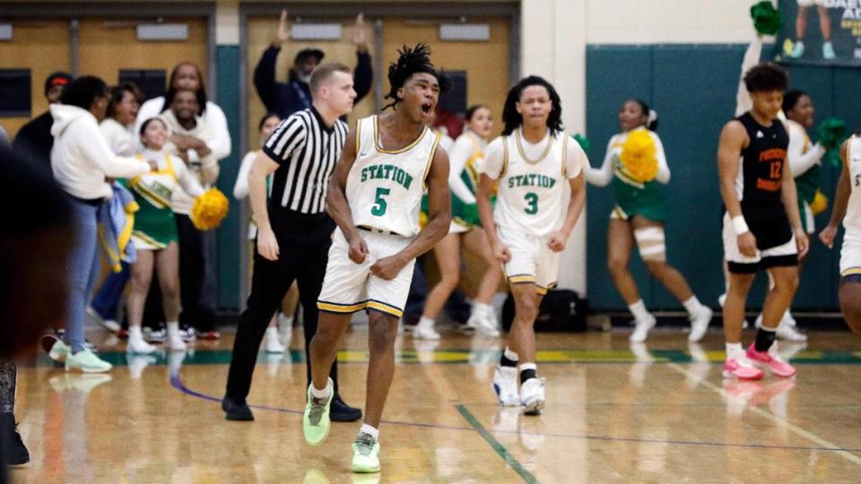 Bryan Station’s Amari Owens (5) celebrates a late-game basket that tied the Defenders’ game against Frederick Douglass on Friday night. Owens was fouled on the play and made the free throw, giving the Defenders its first lead since the game’s opening possession.