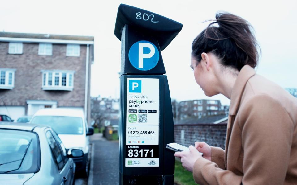 a driver buys a parking ticket using a smartphone app