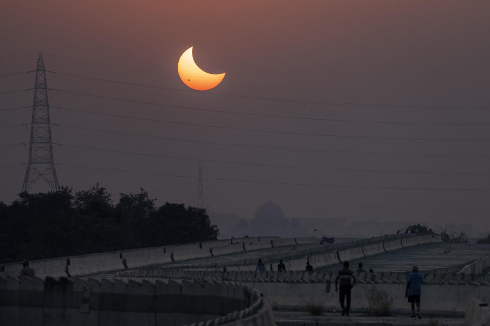A partial solar eclipse is seen over New Delhi, India, on Oct. 25, 2022. / Credit: Altaf Qadri / AP