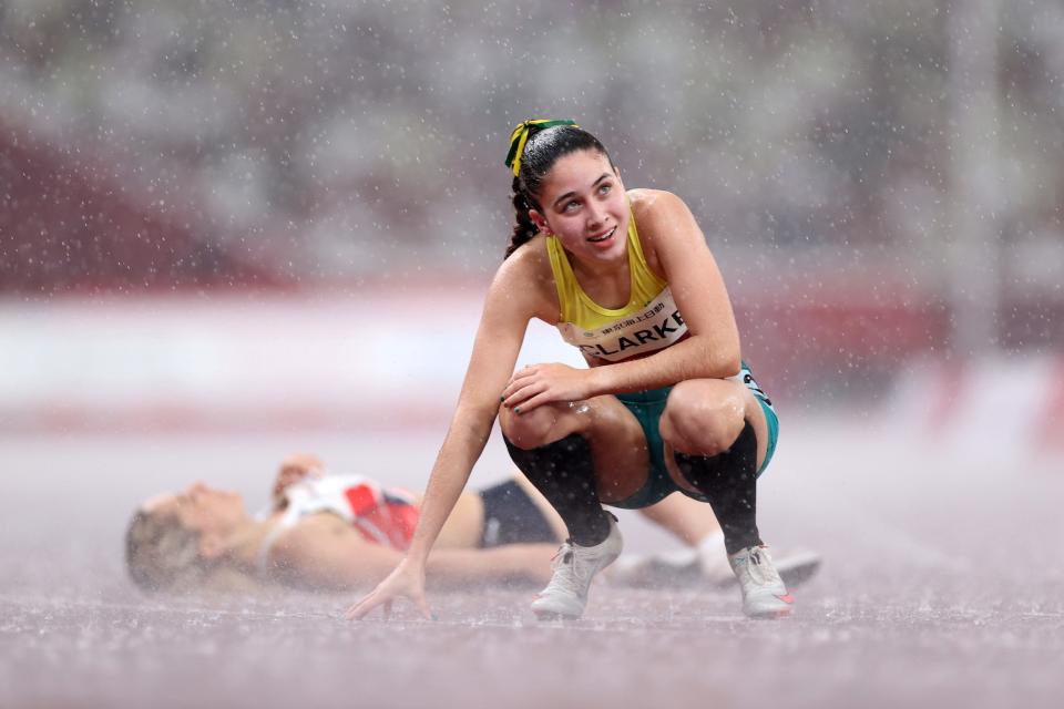 Australian Rhiannon Clarke reacts after competing in the 400m in the rain at the Tokyo Paralympics.