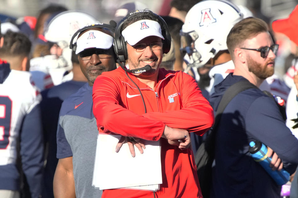 Arizona head coach Jedd Fisch, center, reacts in the second half during an NCAA college football game against Arizona State, Saturday, Nov. 25, 2023, in Tempe, Ariz. (AP Photo/Rick Scuteri)