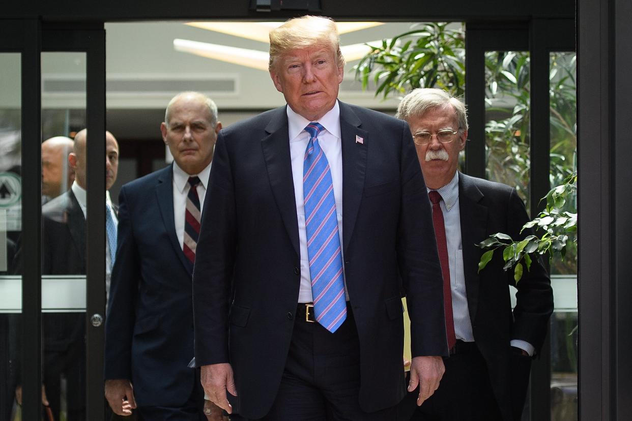 US President Donald Trump leaves with Chief of Staff John Kelly and National Security Advisor John Bolton after a press conference at the G7 Summit: Leon Neal/Getty Images