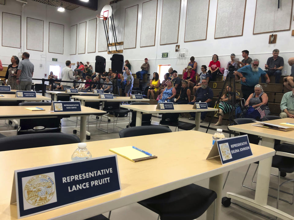 Spectators fill bleachers inside the Wasilla Middle School gym ahead of a legislative meeting Monday, July 8, 2019 in Wasilla, Alaska. In a rare move, nearly a third of Alaska lawmakers are expected to buck their leadership in both chambers and meet Monday in Wasilla even though a majority of lawmakers will convene the special session in Juneau, the state capital, about 600 miles away. (AP Photo/Mark Thiessen)