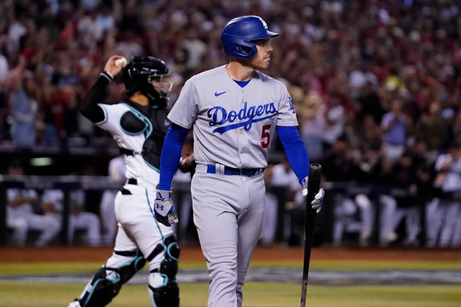 Los Angeles Dodgers’ Freddie Freeman, center, reacts after striking out during the eighth inning in Game 3 of a baseball NL Division Series against the Arizona Diamondbacks, Wednesday, Oct. 11, 2023, in Phoenix. (AP Photo/Ross D. Franklin)