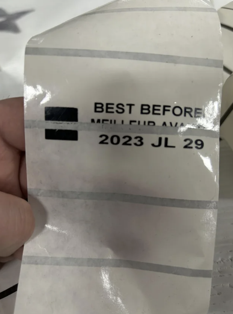 Label with type, including "best before" date, cut off