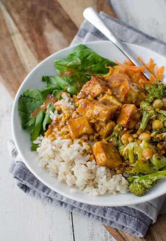 <p>Delish Knowledge</p><p>Brown rice, the best peanut tofu, vegetables and roasted broccoli in a simple peanut sauce. If you are looking for a healthy buddha bowl recipe, this is it! A gluten-free and vegan lunch or dinner.</p><p><strong>Get the recipe: <a href="https://www.delishknowledge.com/peanut-tofu-buddha-bowl/" rel="nofollow noopener" target="_blank" data-ylk="slk:Peanut Tofu Buddha Bowl;elm:context_link;itc:0;sec:content-canvas" class="link "><em>Peanut Tofu Buddha Bowl</em></a></strong></p>