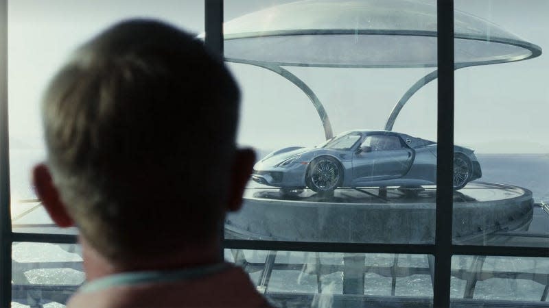 Benoit Blanc, played by Daniel Craig, looks at Miles Bron's Porsche 918 Spyder in Glass Onion: A Knives Out Story