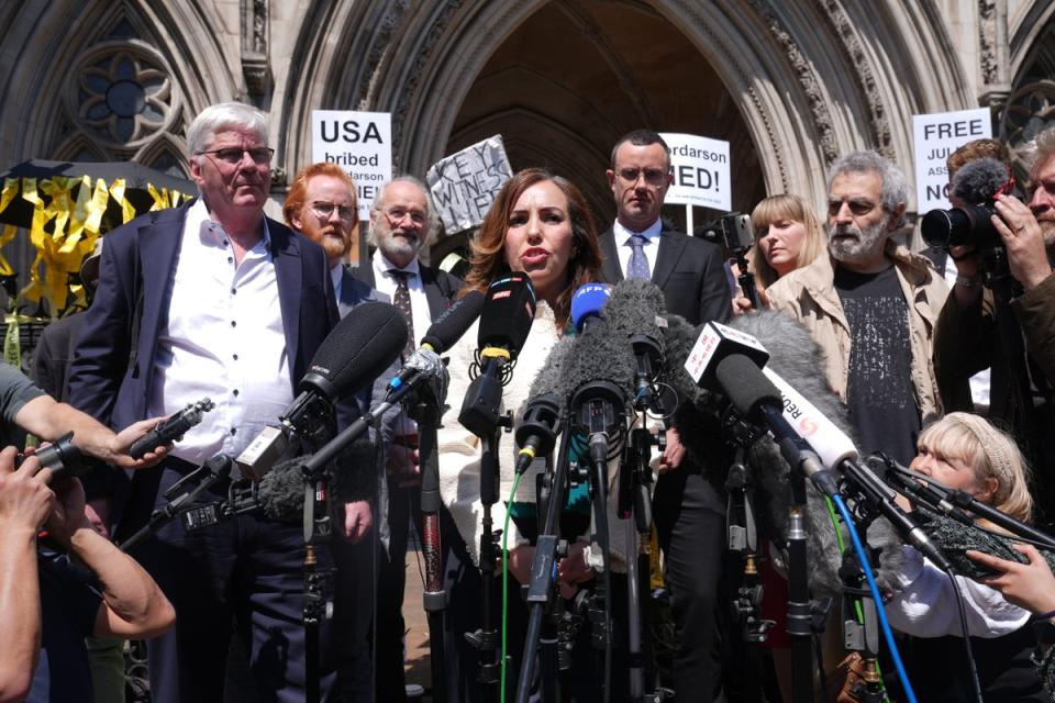 Stella Assange, the wife of Julian Assange, gives a statement outside the Royal Courts of Justice in London, after he won a bid at the High Court to bring an appeal against his extradition to the US (Lucy North/PA) (PA Wire)