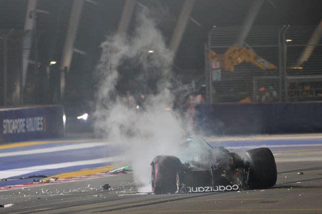 Smoke billows from Lance Stroll's Aston Martin 