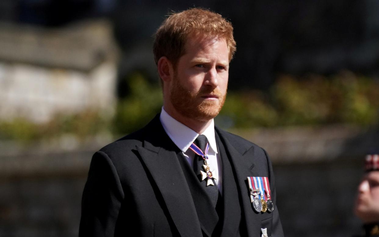 Prince Harry walking in the procession at Windsor Castle, Berkshire, during his grandfather's funeral - Victoria Jones/REUTERS