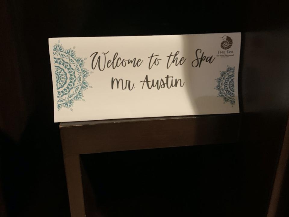 A personalized note that says, "Welcome to the spa, Mr. Austin." in cursive writing.