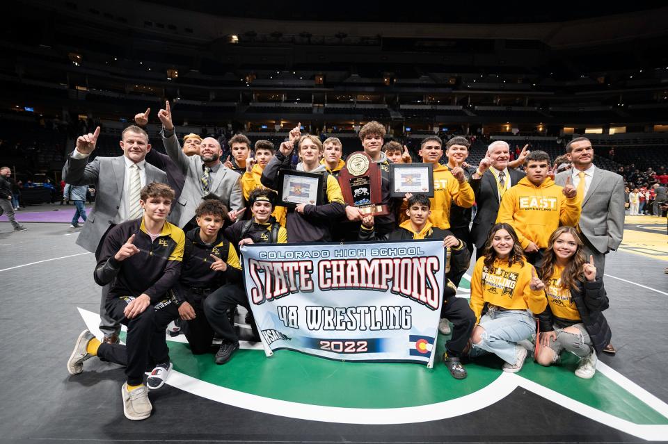 The Pueblo East boys wrestling team celebrate after winning the Class 4A state tournament at Ball Arena on Saturday, February, 19, 2022.