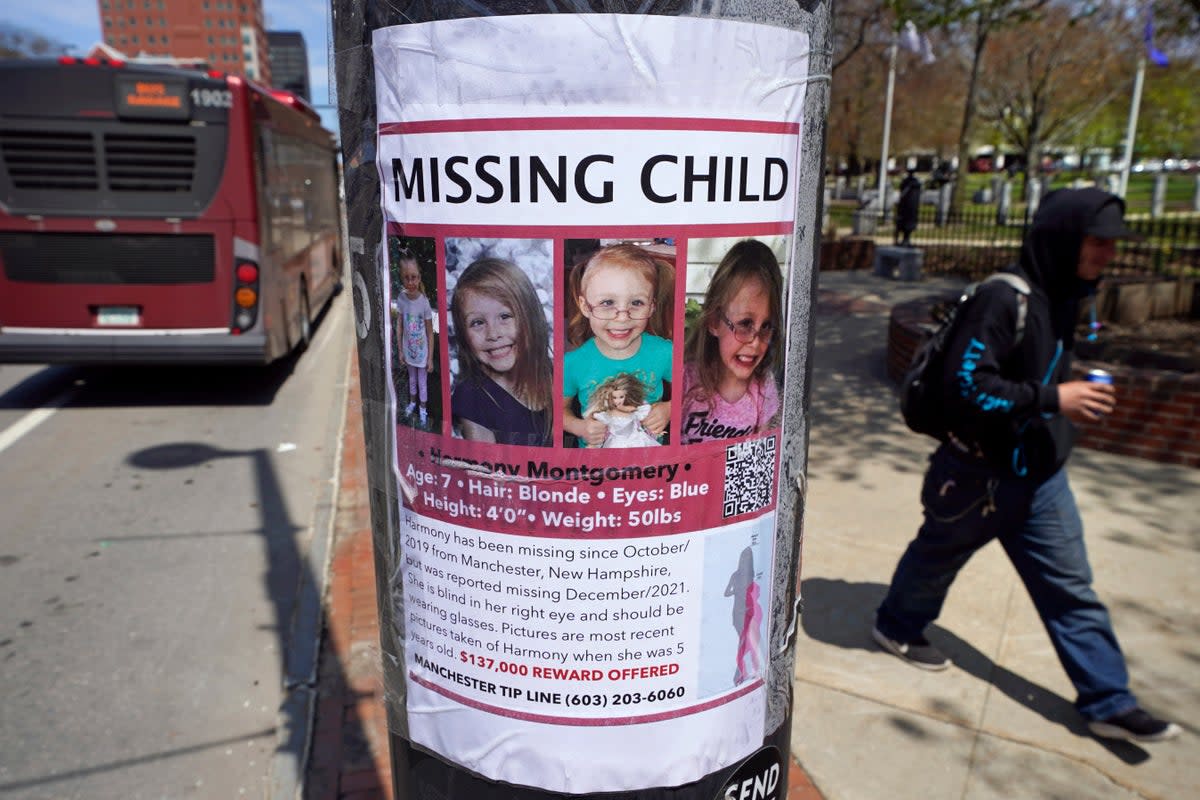 A man walks past a missing child poster for Harmony Montgomery (AP)