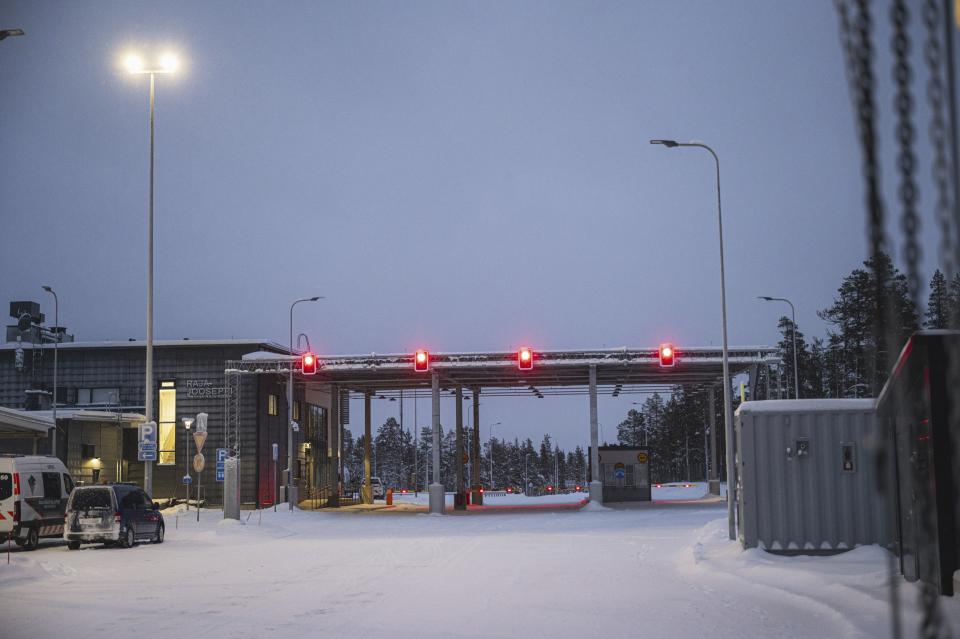 Red lights are seen at the Raja-Jooseppi international border crossing station in Inari, northern Finland, on Wednesday, Nov. 29, 2023. Finland says it will close its last remaining border crossing with Russia amid concerns that Moscow is using migrants as part of “hybrid warfare” to destabilize the Nordic country following its entry into NATO. (Otto Ponto/Lehtikuva via AP)