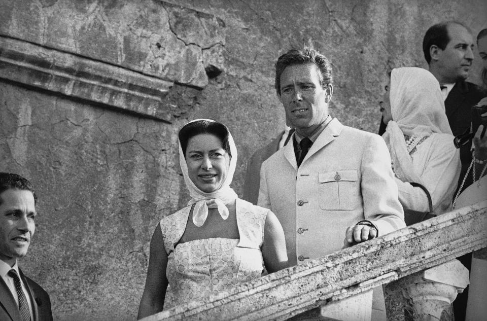 Princess Margaret of Britain and her husband, Lord Snowdon, descending the steps that lead from the famed Villa d’Este into the “Garden of the Fountains” of the villa at the hill resort Tivoli, 35 kilometers (22 miles) east of Rome, Italy on August 24, 1965, as they went sightseeing there. The princess and her husband arrived in Rome on August 23, to spend a few days with American art writer Milton Gendel, Rome correspondent for Art News Magazine, and his wife, Judith. (AP Photo/Giulio Broglio)