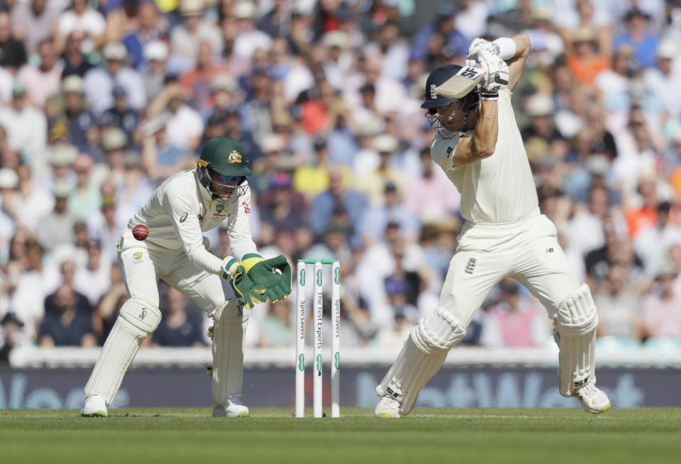 England's Joe Denly plays a shot off the bowling of Australia's Nathan Lyon during the third day of the fifth Ashes test match between England and Australia at the Oval cricket ground in London, Saturday, Sept. 14, 2019. (AP Photo/Kirsty Wigglesworth)