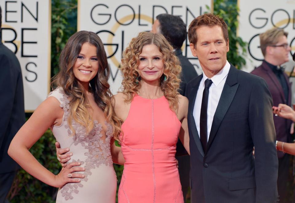 From left, Sosie Bacon, Kyra Sedgwick and Kevin Bacon arrive at the 71st annual Golden Globe Awards at the Beverly Hilton Hotel on Sunday, Jan. 12, 2014, in Beverly Hills, Calif. (Photo by John Shearer/Invision/AP)