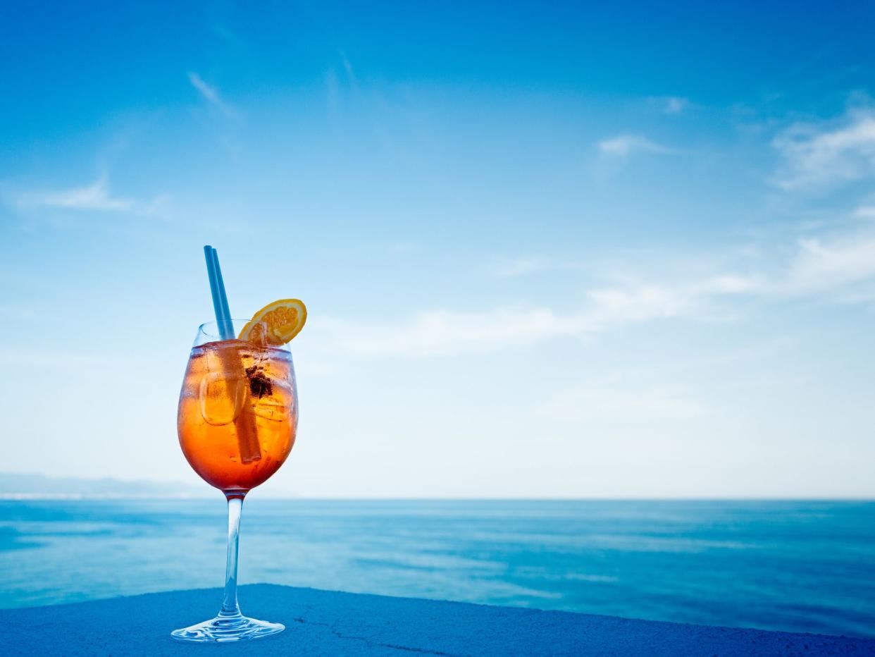 Aperol Spitz and sea background. Portofino, Italy