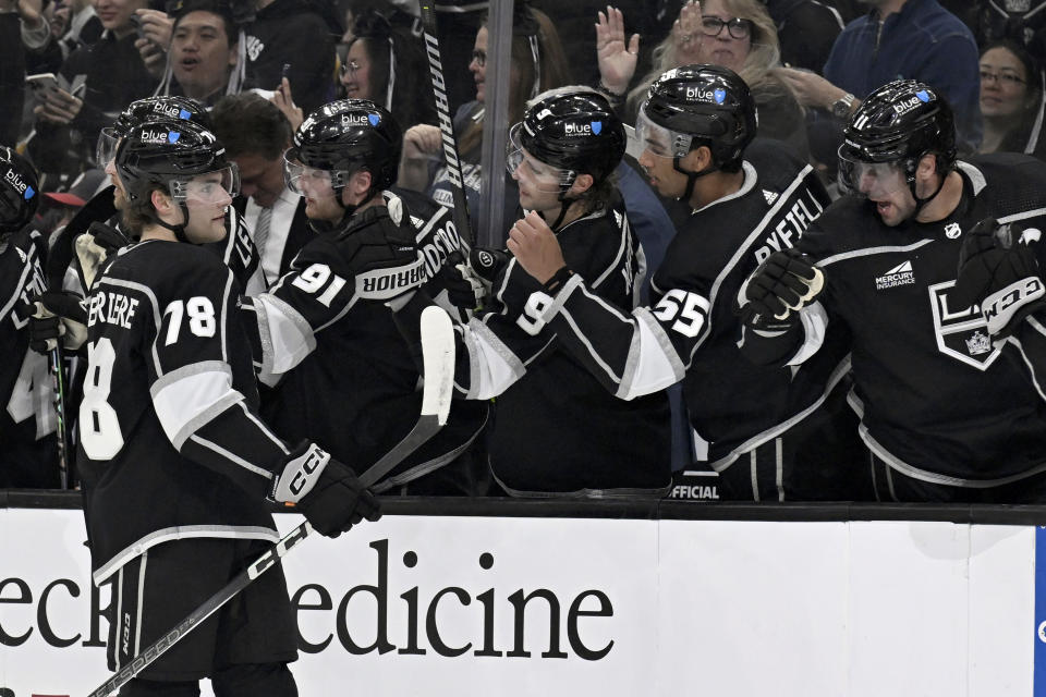 Los Angeles Kings right wing Alex Laferriere (78) celebrates is congratulated for his goal against the Vegas Golden Knights during the first period of an NHL hockey game in Los Angeles, Saturday, Oct. 28, 2023. (AP Photo/Alex Gallardo)