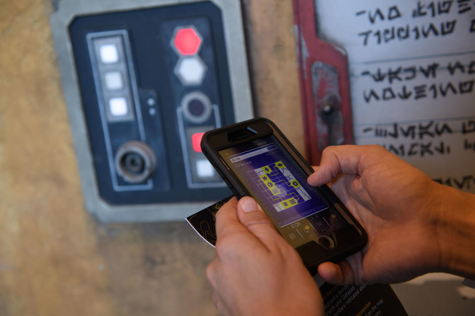 Star Wars: Galaxy's Edge is the first land within a Disney park designed to integrate with the Play Disney Parks mobile app, which debuted last year. Guests who choose to use the Play Disney Parks app in Star Wars: Galaxy's Edge at Disneyland Park in Anaheim, California, and at Disney's Hollywood Studios in Lake Buena Vista, Florida, will be able to transform it into their very own Star Wars: Datapad. The app provides new opportunities for guests to engage with the land. (Richard Harbaugh/Disney Parks)