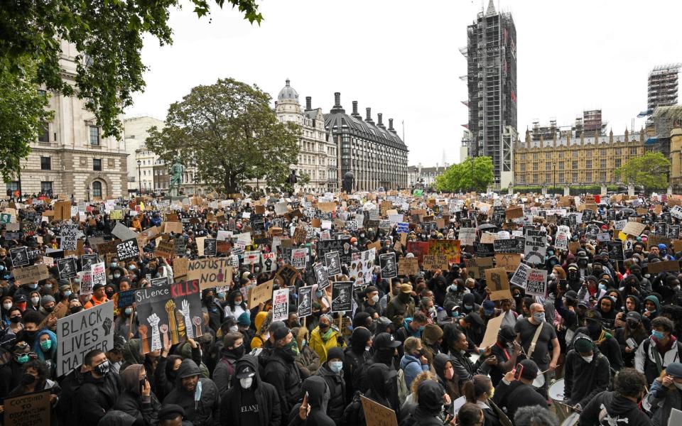 Streams of demonstrators continue to cross Westminster Bridge to join the Parliament Square protest - Stefan Rousseau/PA