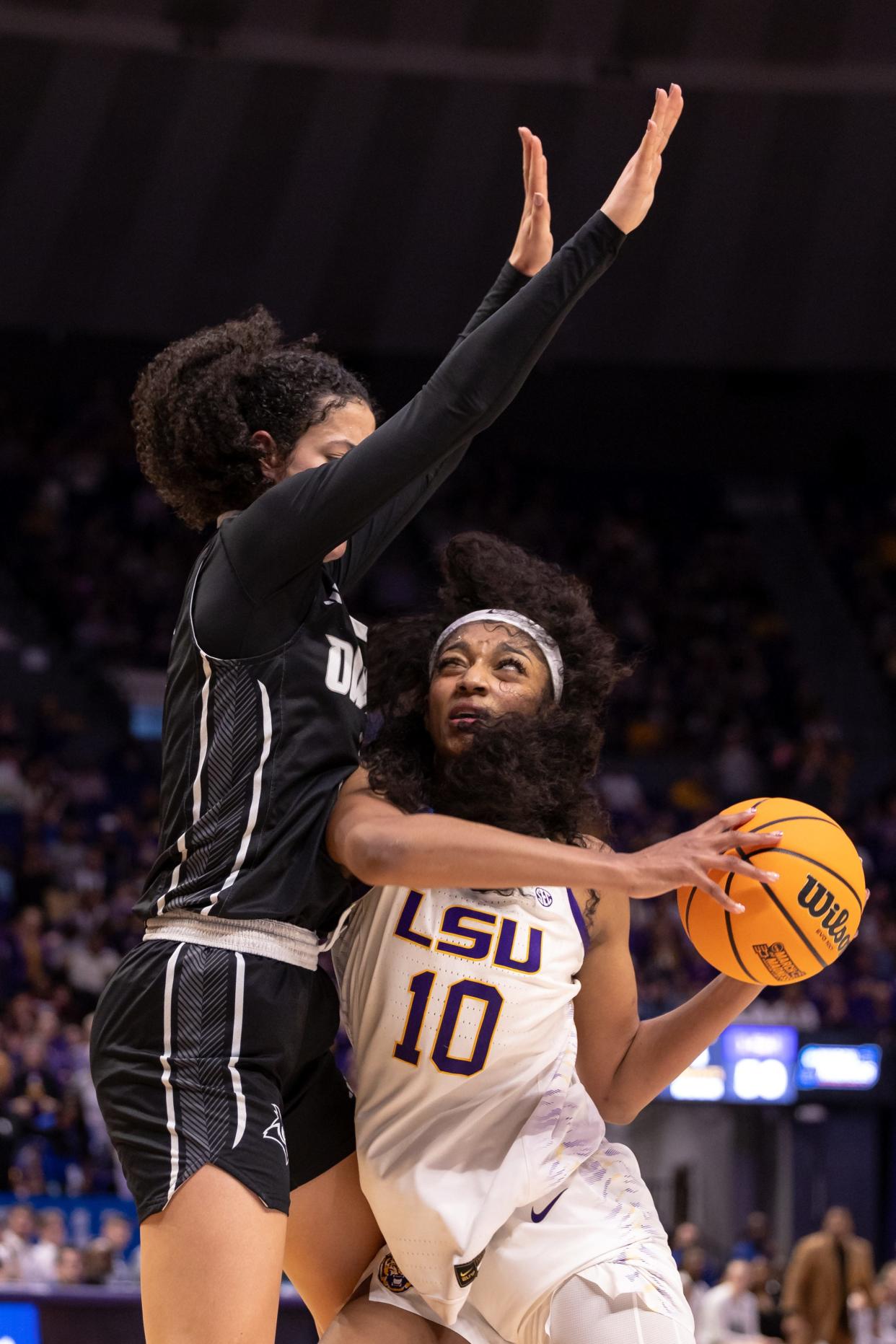 Mar 22, 2024; Baton Rouge, Louisiana, USA; LSU Lady Tigers forward Angel Reese (10) dribbles against the Rice Owls during the second half at Pete Maravich Assembly Center. Mandatory Credit: Stephen Lew-USA TODAY Sports