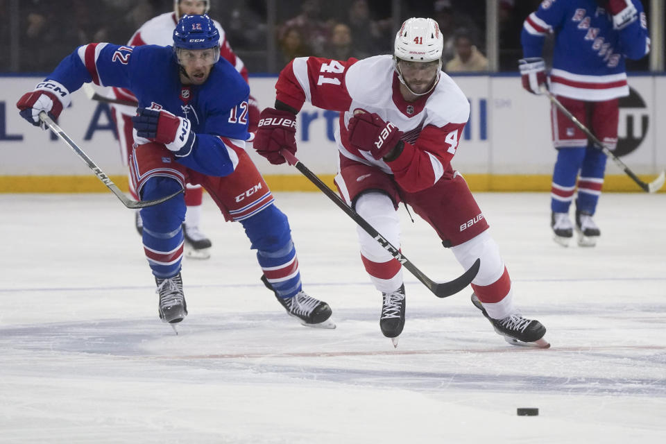 Detroit Red Wings' Shayne Gostisbehere, right, breaks away from New York Rangers' Nick Bonino in a chase for the puck, during the second period of an NHL hockey game, Wednesday, Nov. 29, 2023, in New York. (AP Photo/Bebeto Matthews)
