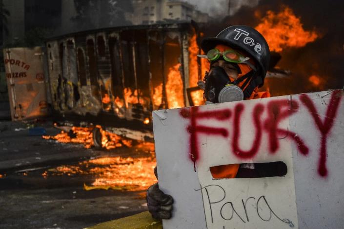 More than 70 people have been killed since the start of opposition protests against Venezuelan President Nicolas Maduro on April 1 (AFP Photo/LUIS ROBAYO)