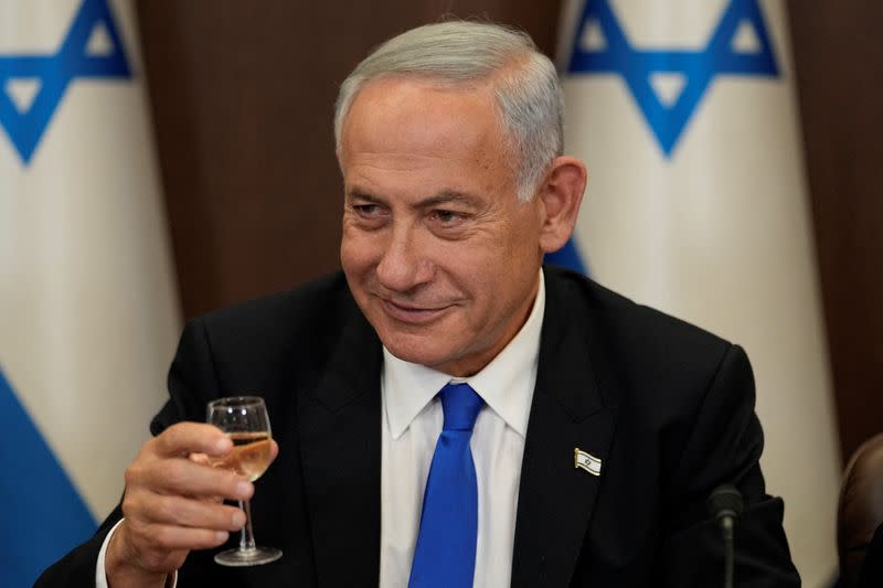 Newly sworn in Israeli Prime Minister Benjamin Netanyahu makes a toast during a cabinet meeting in Jerusalem