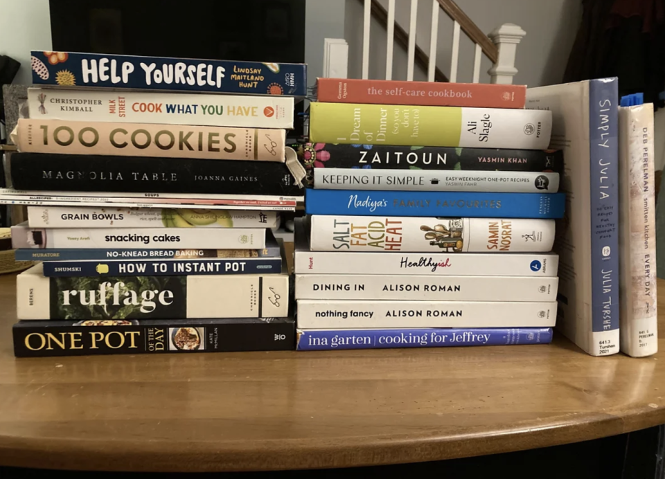 A Reddit post by u/CookbookLovers shows a collection of cookbooks on a bookshelf. The post mentions scanning pages and lists titles like "Half Baked Harvest."