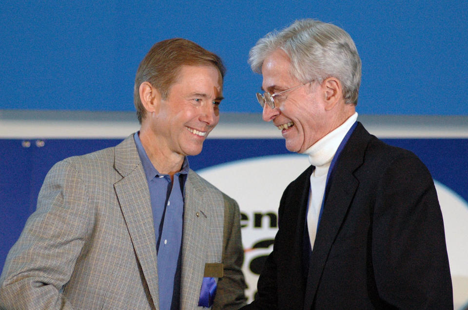 STS-9 crewmates Brewster Shaw and John Young, seen together at Shaw's induction into the U.S. Astronaut Hall of Fame at NASA's Kennedy Space Center in Florida in 2006. <cite>collectSPACE.com</cite>