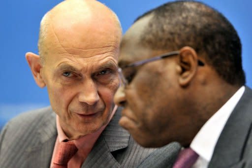 World Trade Organization's (WTO) director-General Pascal Lamy (L) reacts next to Chairman of the conference Olusegun Aganga during the opening of a WTO ministerial conference in Geneva. The World Trade Organisation wrapped up its ministerial meeting Saturday still deadlocked on the Doha Round of negotiations for a global free trade pact with some ministers calling for a new path