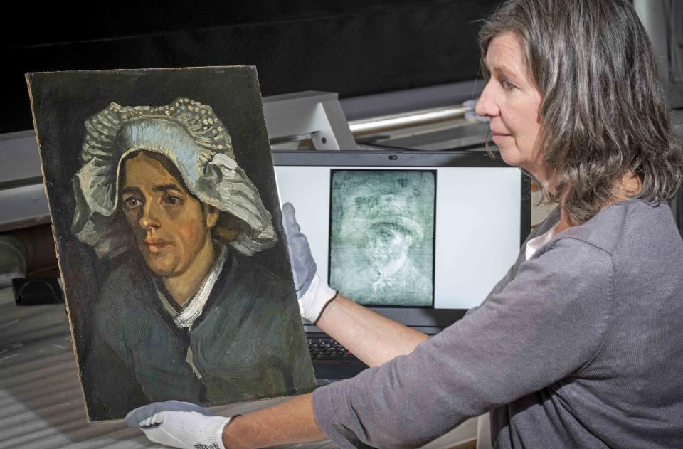 Senior Conservator Lesley Stevenson views Head of a Peasant Woman alongside an x ray image of the hidden Van Gogh self portrait. A previously unknown self-portrait of Vincent Van Gogh has been discovered behind another of the artist’s paintings. The National Galleries of Scotland said Thursday it was discovered on the back of Van Gogh’s “Head of a Peasant Woman” when experts took an X-Ray of the canvas ahead of an upcoming exhibition. (Neil Hanna via AP)