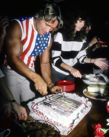 <p>Michael Ochs Archives/Getty</p> Arnold Schwarzenegger celebrates his U.S. citizenship on Sept. 17, 1983.