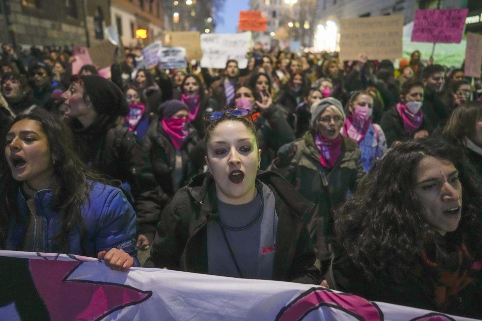 FILE - Demonstrators march to celebrate the International Women's Day in Rome, Tuesday, March 8, 2022. Advocates for women and the LGBTQ community in Italy are worrying that the decisive victory by Giorgia Meloni and her far-right party in Italy's national election which took place Sunday, Sept. 25, 2022, will bring setbacks for civil rights. (AP Photo/Andrew Medichini, File )