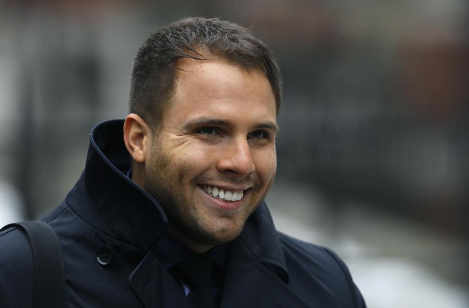 Former News of the World showbusiness editor, Dan Wootton, arrives to give evidence at the Leveson Inquiry into the culture, practices and ethics of the media, at the High Court in London February 6, 2012. REUTERS/Suzanne Plunkett (BRITAIN - Tags: MEDIA CRIME LAW SOCIETY)