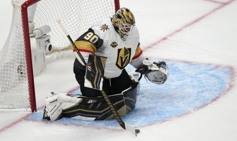 Vegas Golden Knights goalie Robin Lehner makes a stick save of a shot while facing the Colorado Avalanche in the first period of an NHL hockey game Tuesday, Oct. 26, 2021, in Denver. (AP Photo/David Zalubowski)