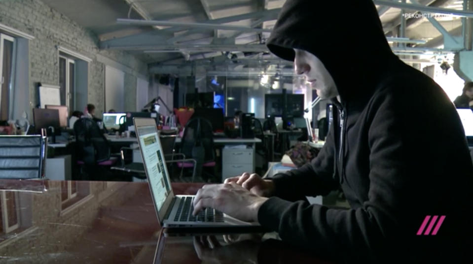 Screen grab of “Maksim” with his face concealed, a former member of the Internet Research Agency troll factory’s elite English language department. (Video still: TV Rain)