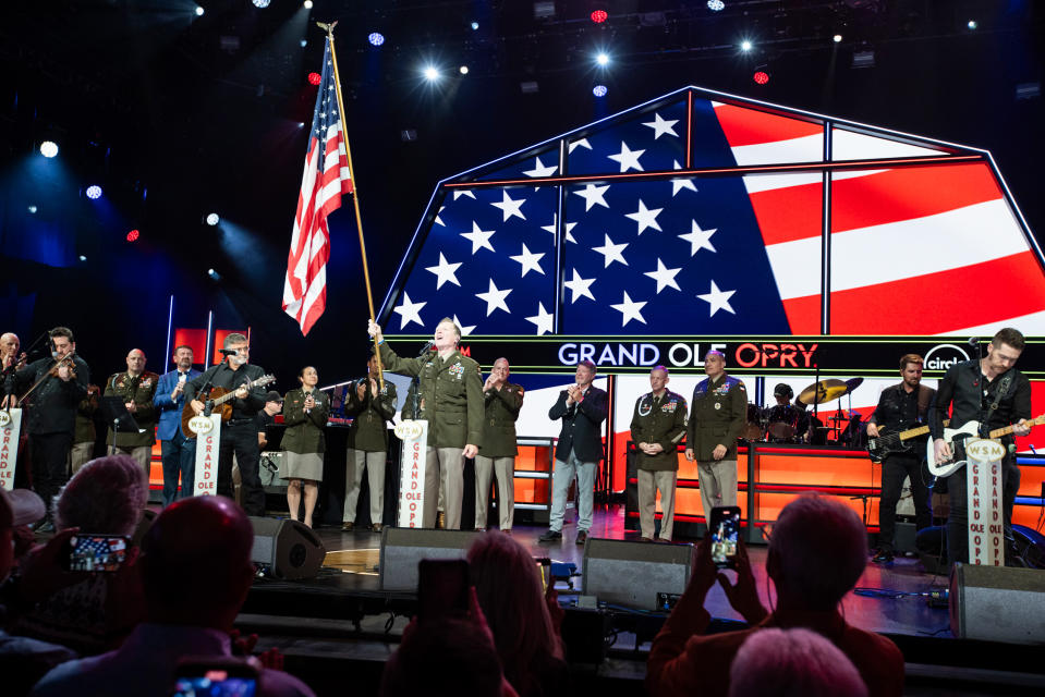 Craig Morgan holds an American flag at the Grand Ole Opry in Nashville on July 29, 2023. (Chris Hollo / Grand Ole Opry)