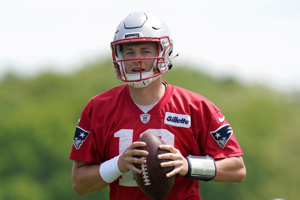 New England Patriots quarterback Mac Jones takes part in drills at the NFL football team's practice facility in Foxborough, Mass., Monday, May 23, 2022. (AP Photo/Steven Senne)