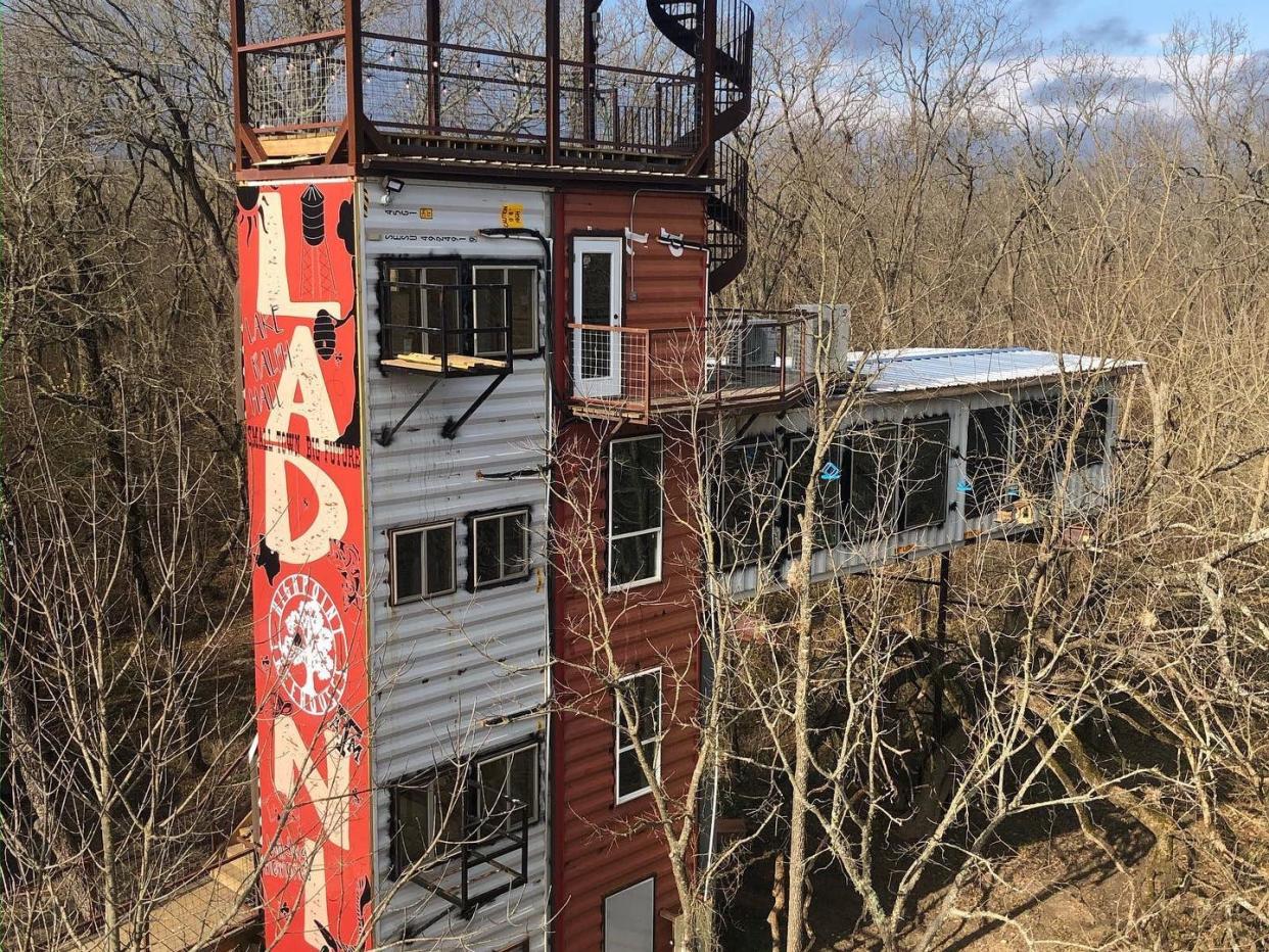 The exterior of the shipping container treehouse.