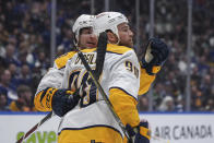 Nashville Predators' Ryan O'Reilly (90) and Luke Evangelista celebrate O'Reilly's goal against the Vancouver Canucks during the second period in Game 1 of an NHL hockey Stanley Cup first-round playoff series in Vancouver, British Columbia, on Sunday, April 21, 2024. (Darryl Dyck/The Canadian Press via AP)
