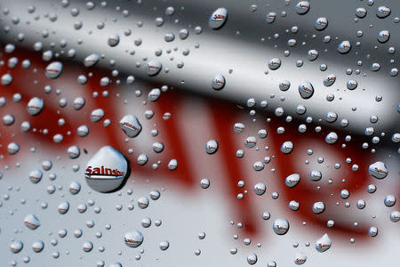 FILE PHOTO: A Sainsbury's sign is seen reflected in raindrops on a window in London January 6, 2015. REUTERS/Stefan Wermuth (BRITAIN - Tags: BUSINESS FOOD LOGO)/File Photo