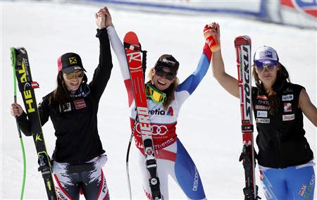 Overall winner Lara Gut of Switzerland (C), second placed Anna Fenninger of Austria (L) and third placed Tina Maze of Slovenia celebrate after women's Super G competition during the FIS Alpine Skiing World Cup finals in the Swiss ski resort of Lenzerheide March 13, 2014. REUTERS/Leonhard Foeger