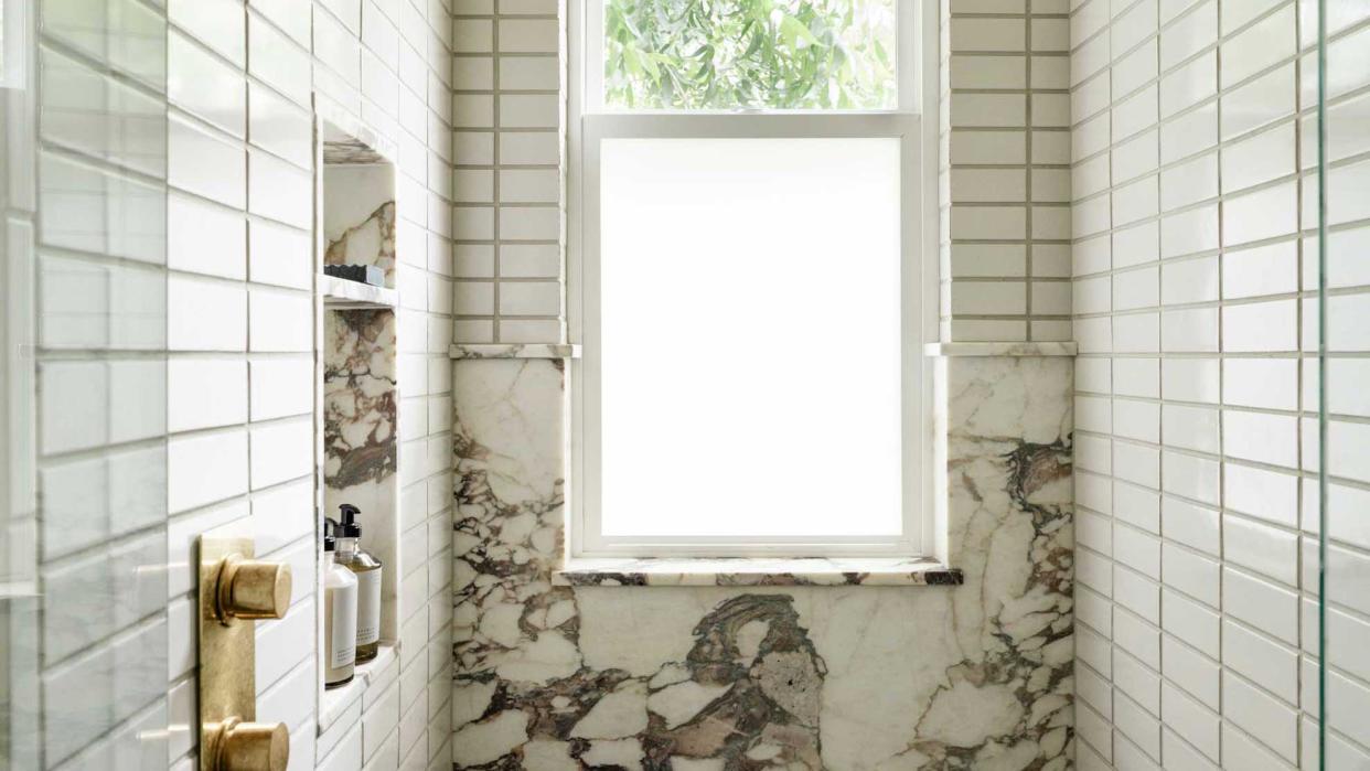  a frosted glass window in a bathroom 