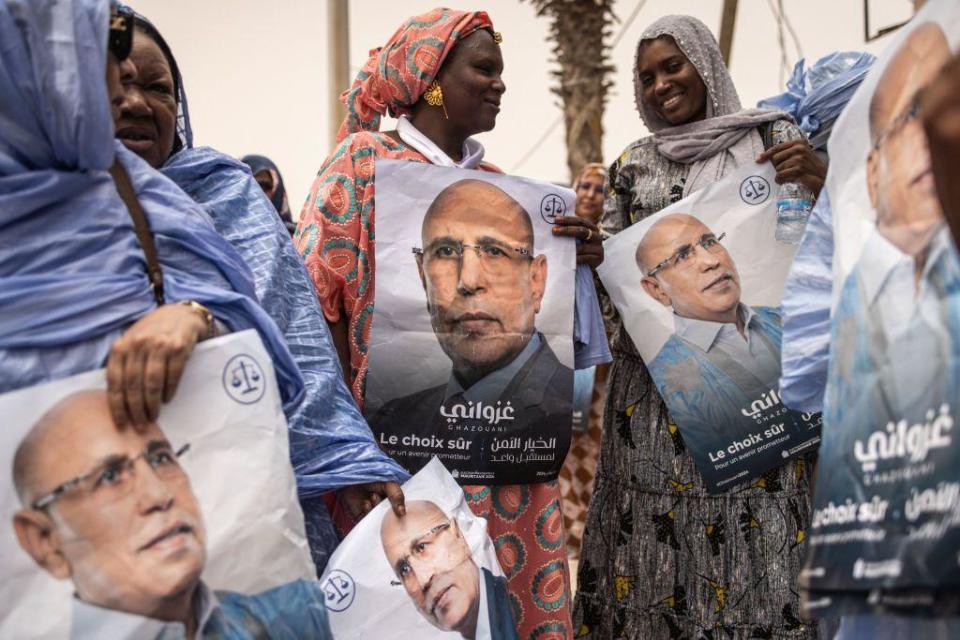  Supporters of the President of Mauritania and leader of the Union for the Republic, Mohamed Ould Cheikh El Ghazouani celebrate in Nouakchott on July 01, 2024. Mauritania's incumbent President Mohamed Ould Cheikh El Ghazouani has comfortably won re-election, receiving 56.12 percent of votes in the first round of the presidential poll, the Independent National Electoral Commission (CENI) said Monday. (Photo by JOHN WESSELS / AFP) (Photo by JOHN WESSELS/AFP via Getty Images)